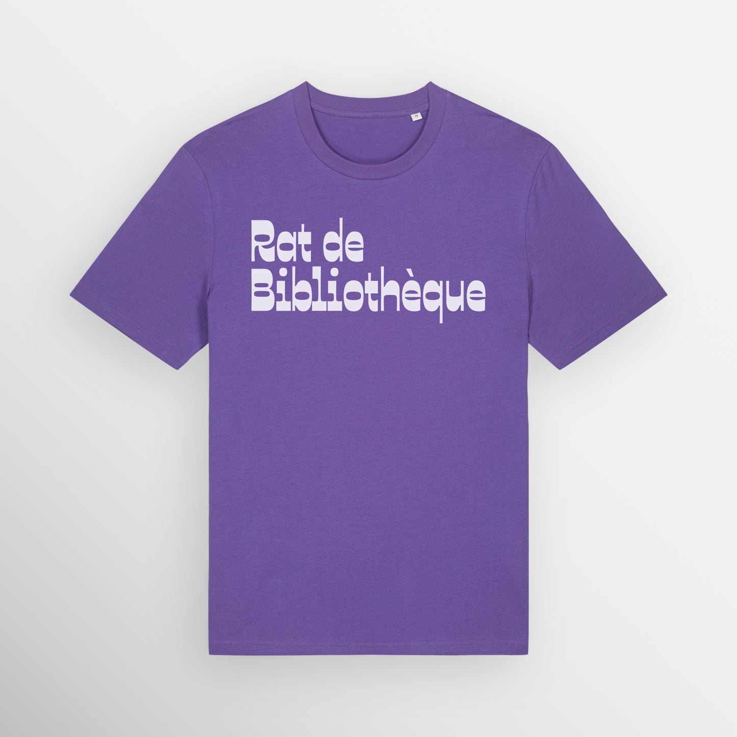 Purple coloured regular fit t-shirt with Rat de Bibliothèque written on the front in white, which is French for bookworm.